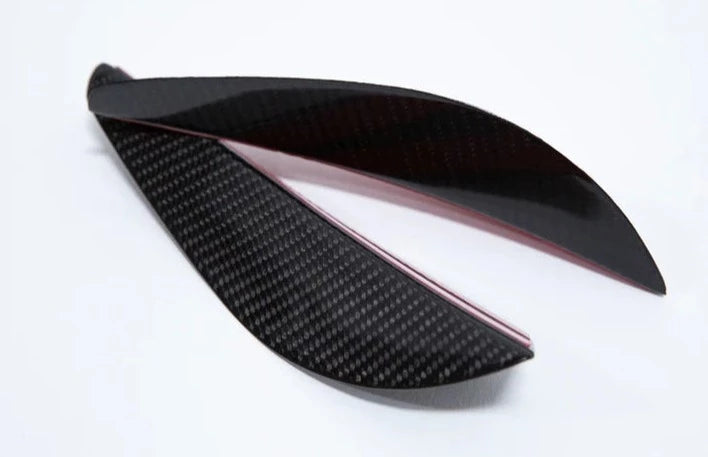 A side wide view of AUTOTECKNIC FRONT BUMPER DRY CARBON CANARD SET - BMW E9X M3 2007-2013 with white background