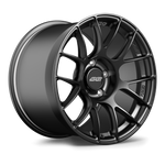 Dark gunmetal forged wheel with multi-spoke design showing center cap and valve stem opening - APEX Wheels wheel for 18x11 ET38 5x120.65 - Satin Black