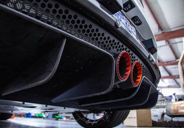 close view of Capristo Valved Exhaust with Carbon Tips (CES3) for Lotus Evora/S 2010–2015 fitted inside a car