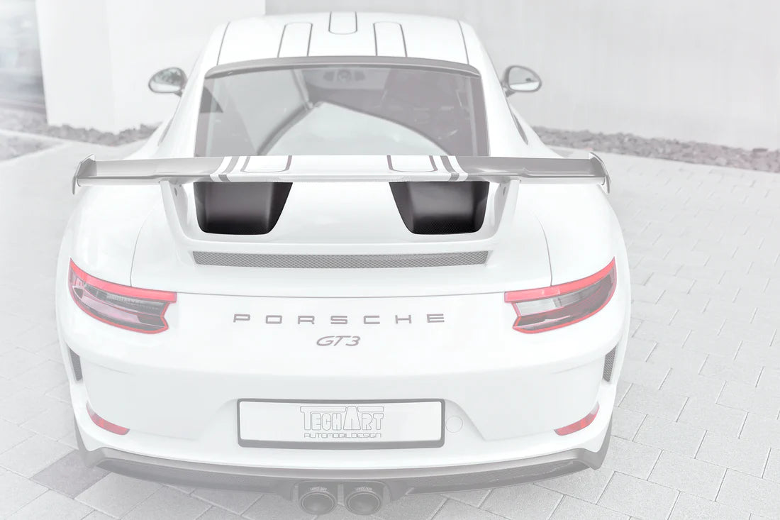 A wide back view of TECHART Engine Air Intake Cover Carbon "matte" for Porsche 991.2 GT3 from MY17 with the cover highlighted