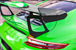 A close up view of TECHART Rear Spoiler Panels Carbon "matte" for Porsche 991.2 GT3 RS from MY18 fitted on a green car 