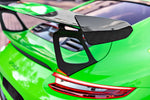 A close up view of TECHART Rear Spoiler Panels Carbon "matte" for Porsche 991.2 GT3 RS from MY18 fitted on a green car 