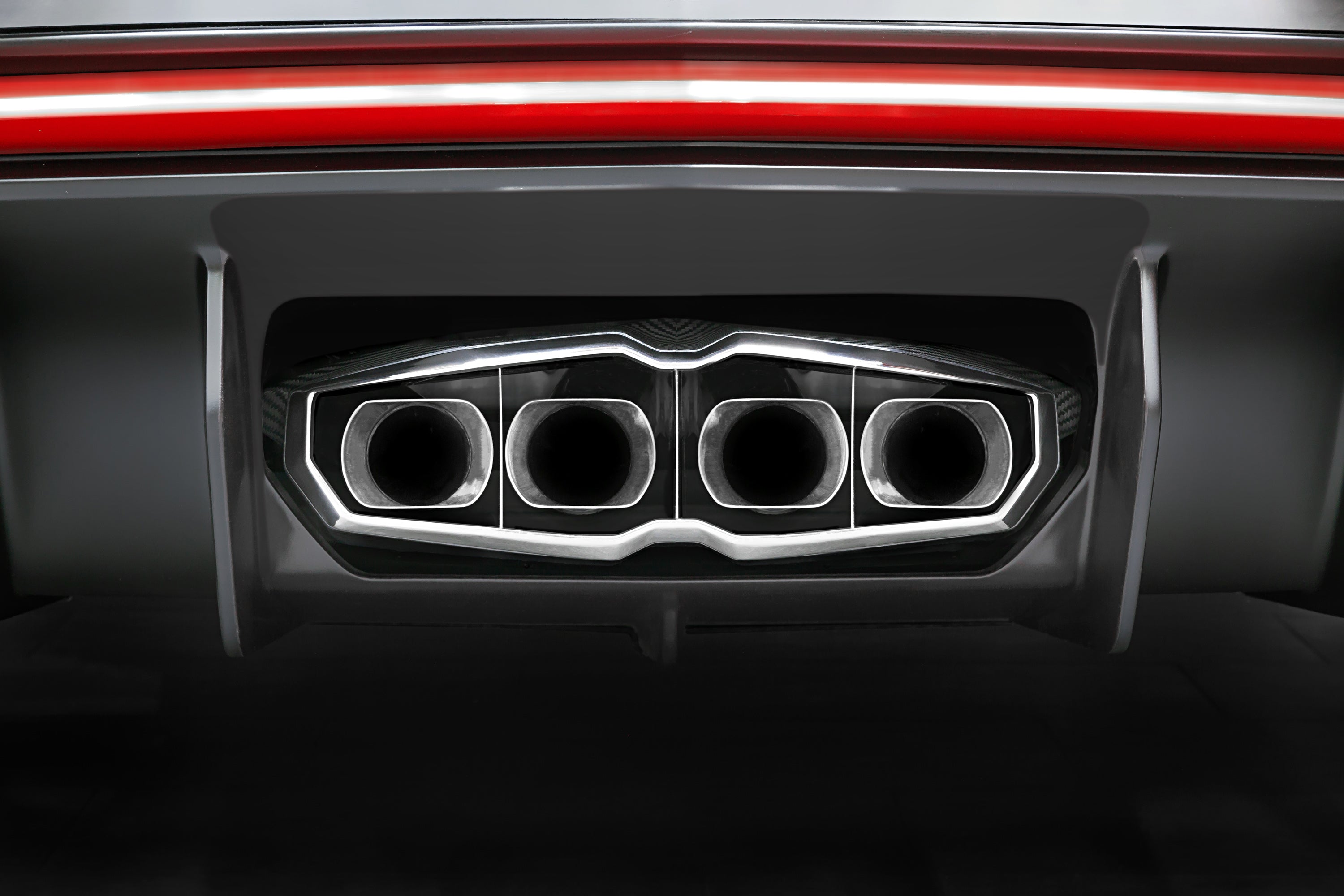 Capristo exhaust frame installed on Lamborghini Aventador rear with four polished round tips