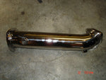 A top view of Evolution Racewerks 1.8T Test Pipe - Audi A4 (B6) on the ground
