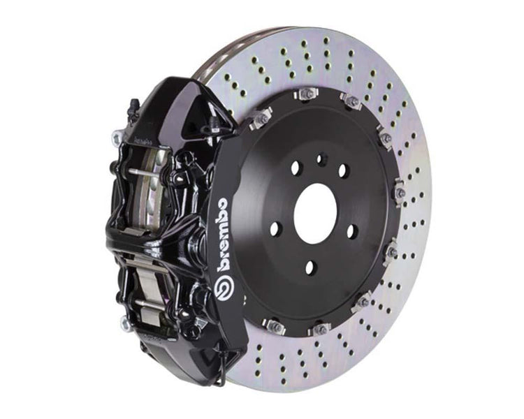A front view of Brembo GT Front Big Brake Kit 405x34 2-Piece 6-Piston Drilled Rotors Volkswagen Tiguan R (Mk2) in black calipers with white background