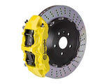 A front view of Brembo GT Front Big Brake Kit 405x34 2-Piece 6-Piston Drilled Rotors Volkswagen Tiguan R (Mk2) in yellow calipers with white background