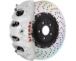 A front view of Brembo GT Front Big Brake Kit 412x38 2-Piece 8-Piston Drilled Rotors for Cadillac Escalade V-Series in white caliper with white background