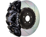 A front view of Brembo GT Front Big Brake Kit 412x38 2-Piece 8-Piston Slotted Rotors for Cadillac Escalade V-Series in black caliper with white background