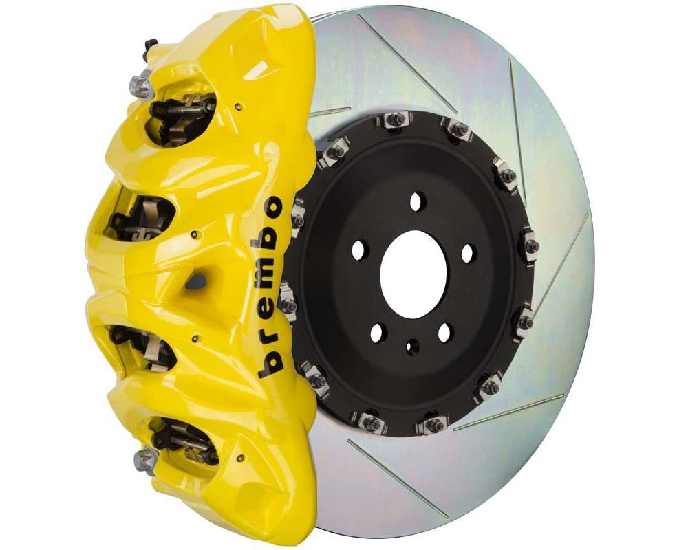 A front view of Brembo GT Front Big Brake Kit 412x38 2-Piece 8-Piston Slotted Rotors for Cadillac Escalade V-Series in yellow caliper with white background