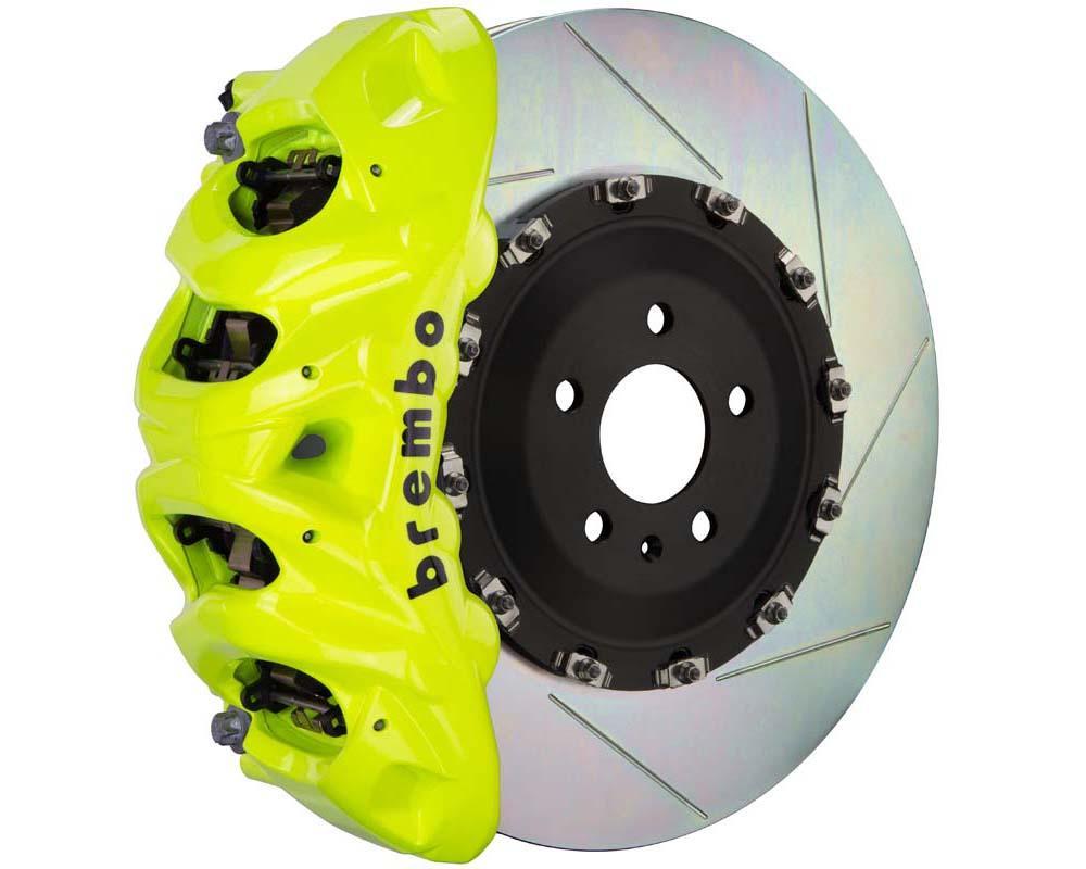 A front view of Brembo GT Front Big Brake Kit 412x38 2-Piece 8-Piston Slotted Rotors for Cadillac Escalade V-Series in fluorescent yellow caliper with white background