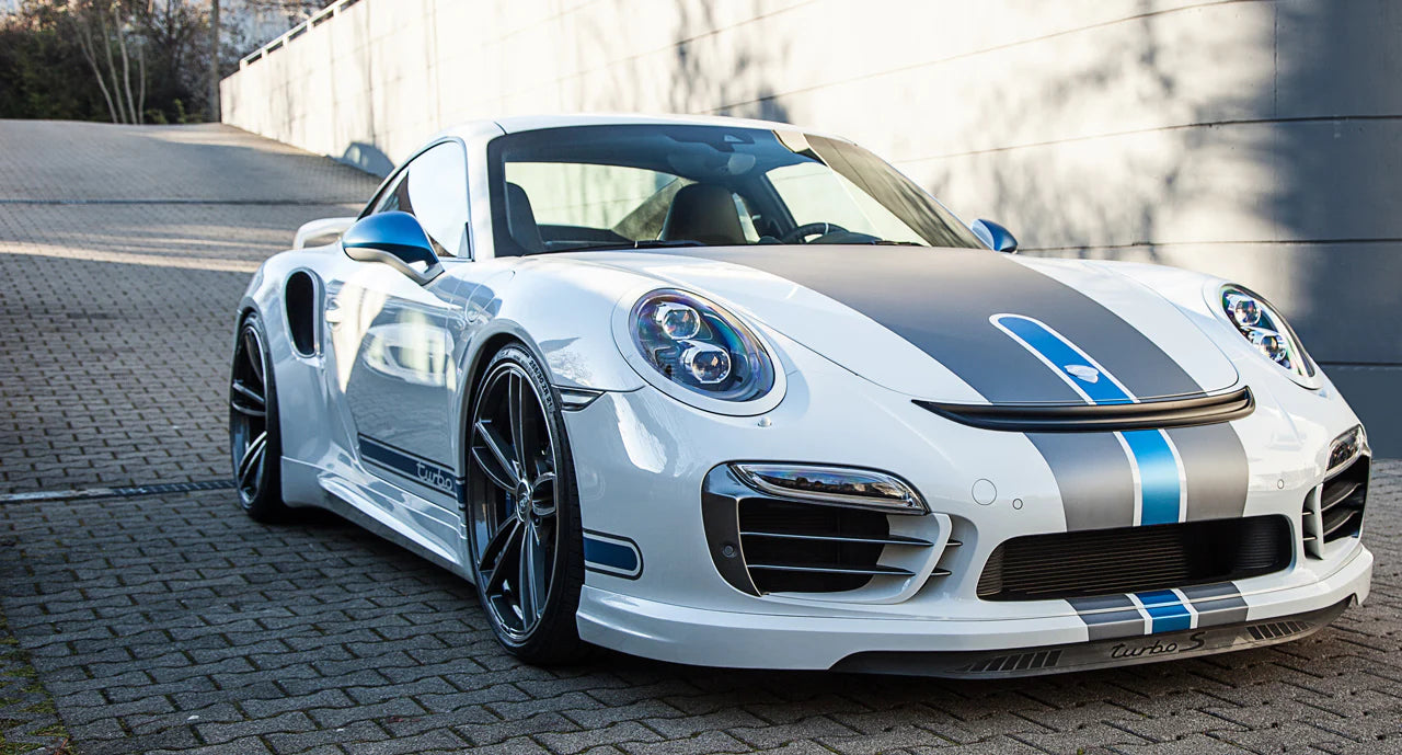 A wide view of TECHART Aero Wings for Porsche 991.1 Turbo until MY16 fitted on a Porsche on the road