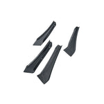 A studio shot on a plain white background showing a complete set of four APR Performance Carbon Fiber Front Bumper Canards. The image displays two pairs of aerodynamic dive planes, highlighting their aggressive, pointed design and high-gloss 2x2 carbon fiber weave pattern.