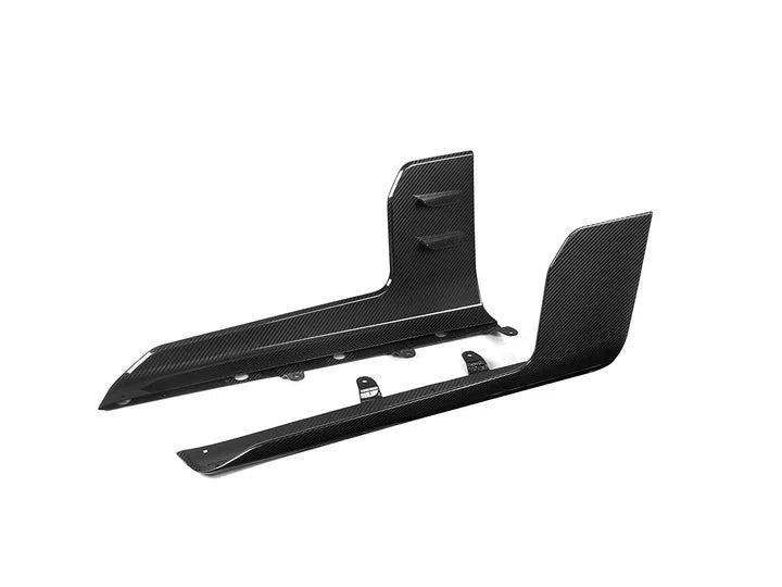 A front view of AUTOTECKNIC DRY CARBON SIDE SKIRT WINGLET SET - BMW G87 M2 2023+ with white background