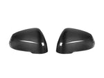 A front view of AUTOTECKNIC DRY CARBON FIBER MIRROR COVER SET - BMW U11 X1 2023+ with white background