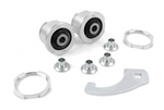 A collection of silver metal automotive parts on a white background, including two cylindrical ball joint housings with black rubber centers, two large threaded locking rings, four small metal spacers, and one flat curved wrench tool.