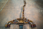 Overhead full view of the Valvetronic Designs Valved Sport Exhaust System for the Nissan GTR R35, including the midpipe, valved muffler section, and quad tips.