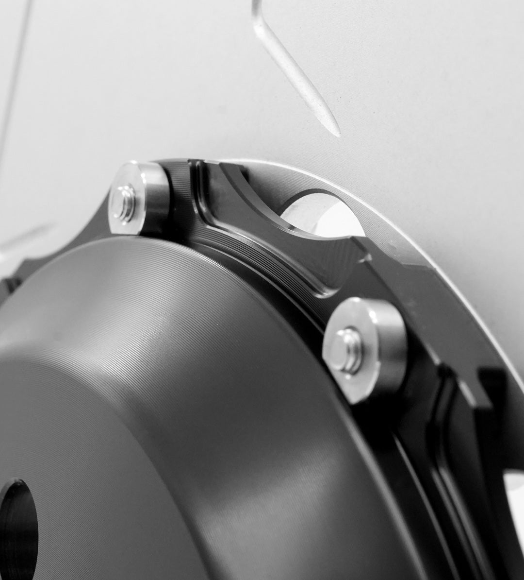 Close-up of front rotor hat and floating mounting bolt