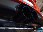 A close up side view of Shark Werks 100mm Exhaust Tips for Porsche 991 / 991.2 GT3 / RS / R fitted on a car from behind 
