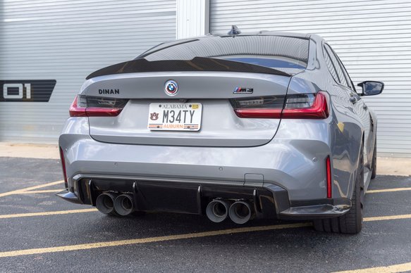 A back wide view of DINAN REAR DIFFUSER SURROUND BMW M3/M4 2021-2024 fitted on a car