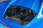 Capristo carbon and glass engine bonnet on a blue Ferrari 488 Spider, angled view