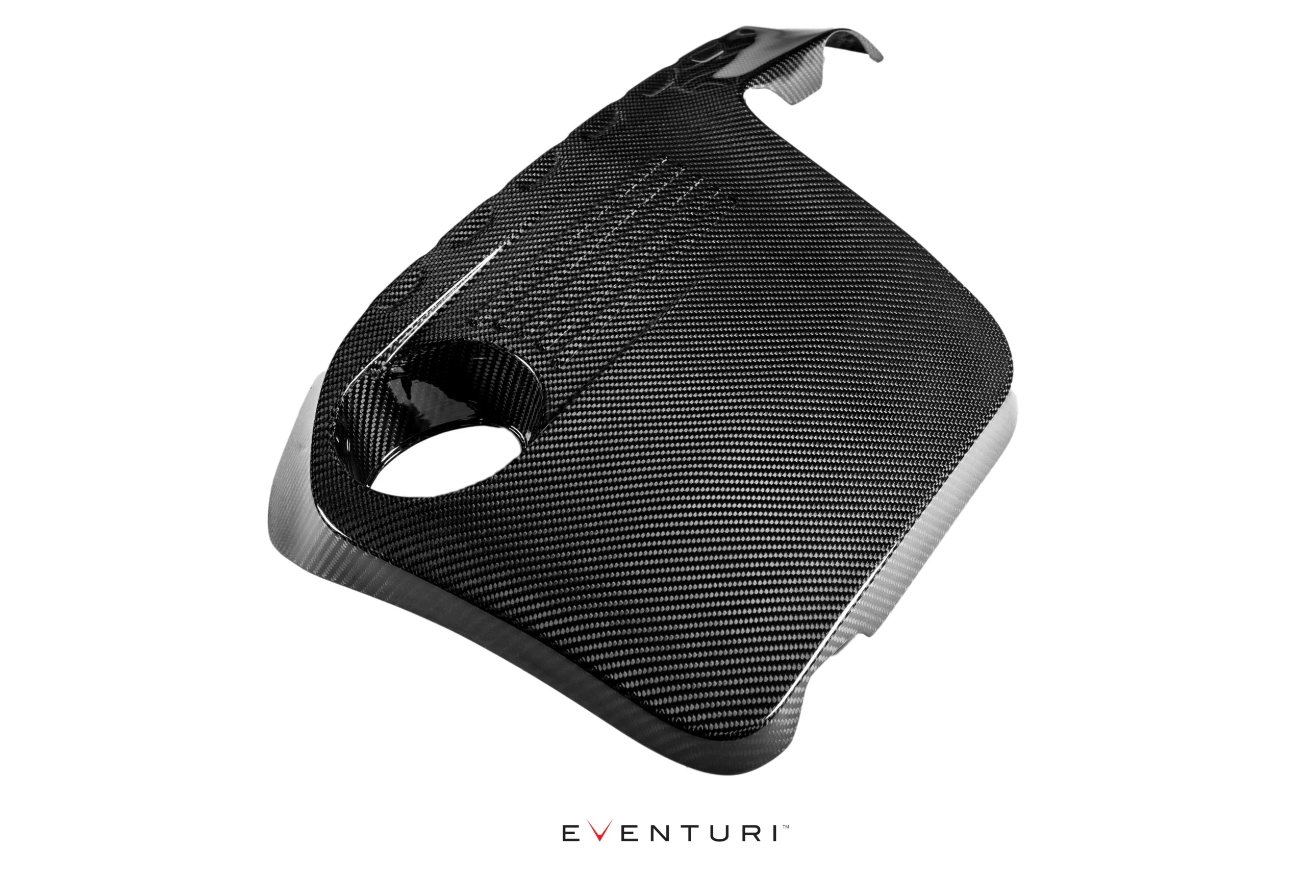 Top-down studio shot of the Eventuri black carbon F8X engine cover