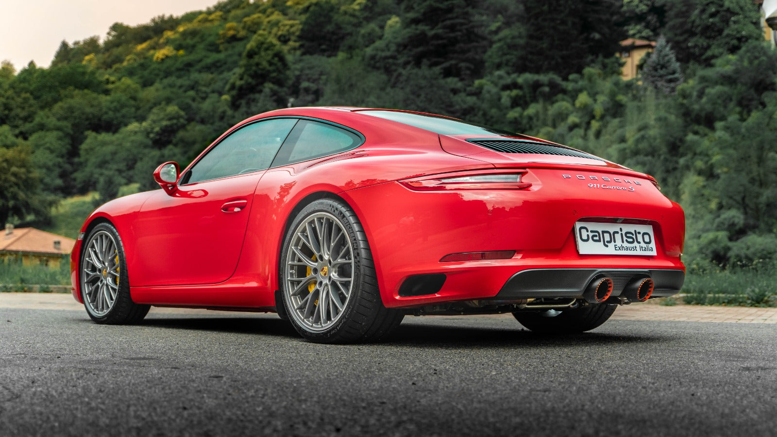 Red Porsche 991.2 Carrera GTS rear three-quarter with Capristo valved exhaust and Wicrom tips