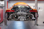 Audi R8 Gen2 on a lift with Capristo valved exhaust being installed