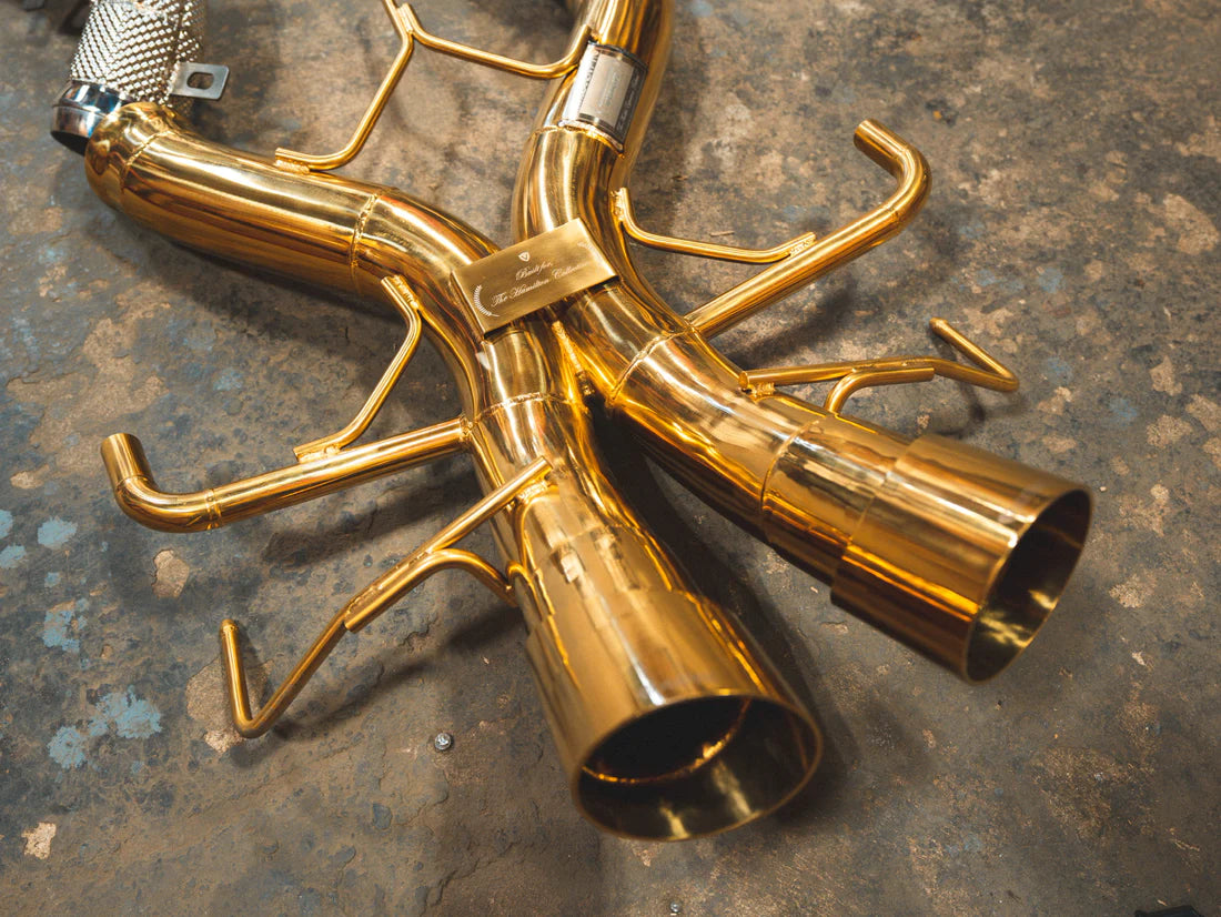 A top overview of Valvetronic Designs Sport Exhaust System's exhaust tips on the ground (for Mclaren P1).