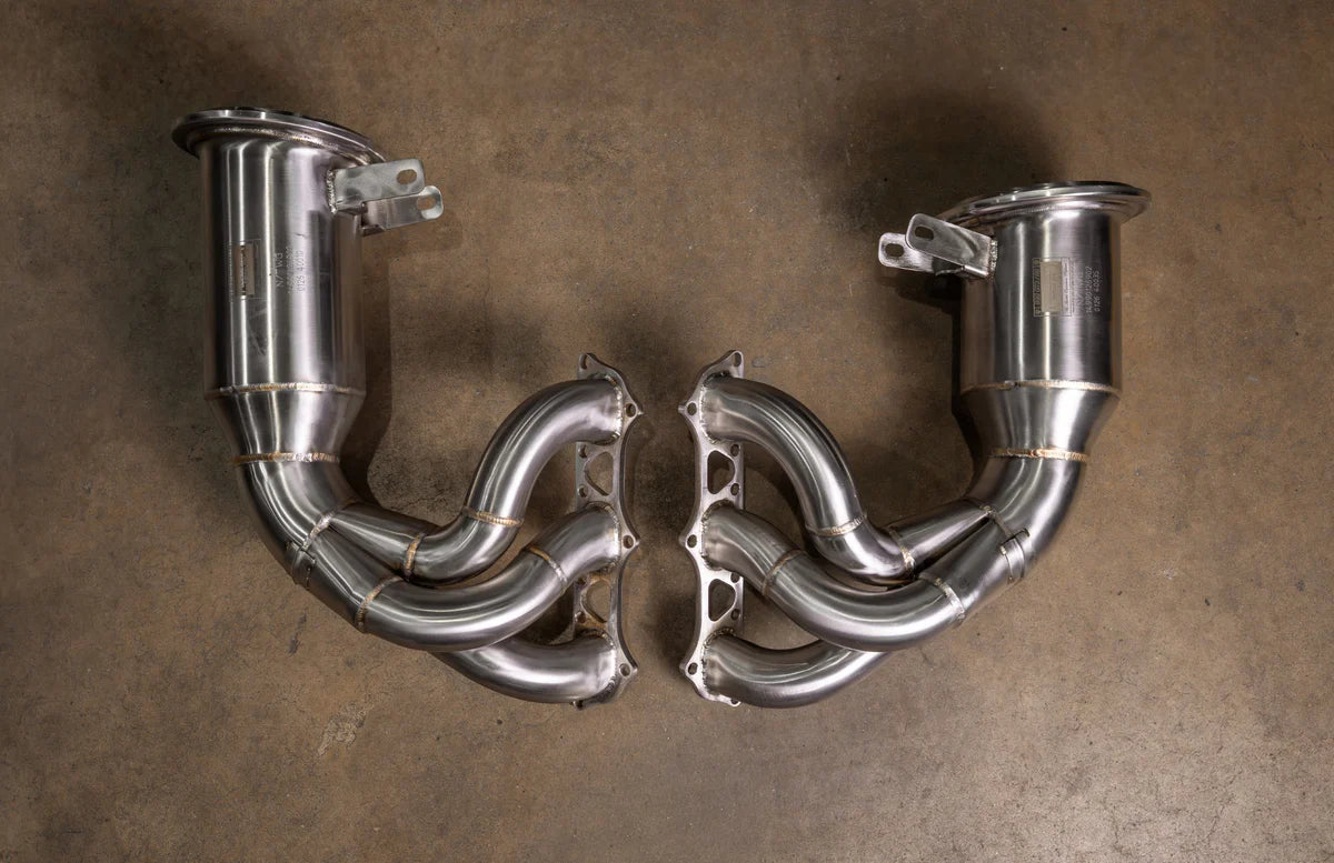 Valvetronic Designs 400-cell catted downpipes for Porsche 992 GT3 and GT3 RS, polished stainless steel.