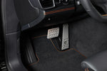 A close up view of TECHART Pedal-Kit, Aluminum Silver Tiptronic/PDK for Porsche 987/981/718 / 997/991 /970 fitted in a car 