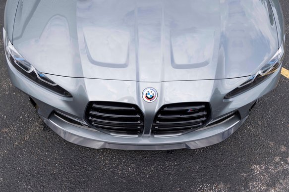 A top view of DINAN FRONT LIP BMW M3/M4 2021-2024 fitted in a car