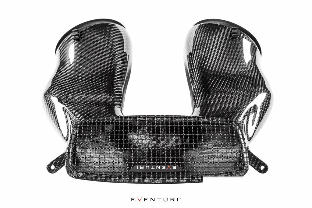 Three-piece carbon fiber intake assembly with curved side ducts and central mesh panel on white background - Eventuri intake for Porsche 911