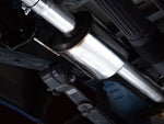 Close underside view of the AWE 0FG stainless pipework running past the F-150 spare tire