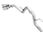 Side angle of the AWE 0FG F-150 side exit system showing the bends ahead of the rear axle