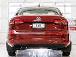 Rear view of a red Mk6 Jetta 1.4T with twin AWE Diamond Black tips under the bumper