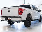 White 2021+ F-150 rear three-quarter view showing the AWE dual split rear Chrome Silver tips