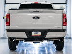 Rear view of a white F-150 in a studio with AWE 5-inch Chrome tips under each side of the bumper