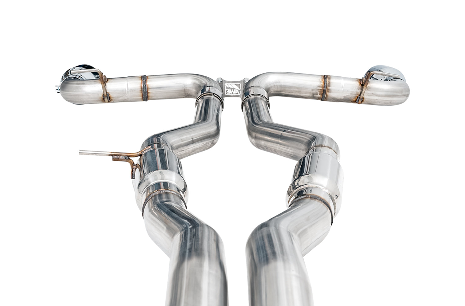 Close look at the AWE Track Edition crossover joint and hangers above the twin mid pipes