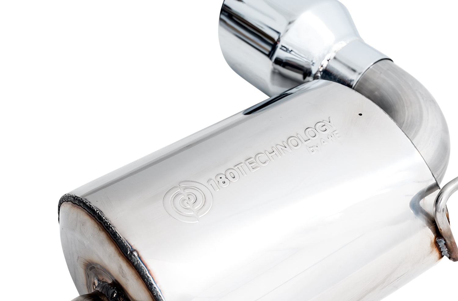 Close-up of the stamped 180 Technology logo on an AWE GR Supra Touring Edition muffler