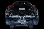 Black A90 Supra rear against a black backdrop with the AWE Touring mufflers visible below