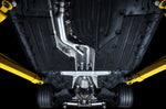 View straight up at an A90 Supra floor showing the AWE Touring system along the tunnel