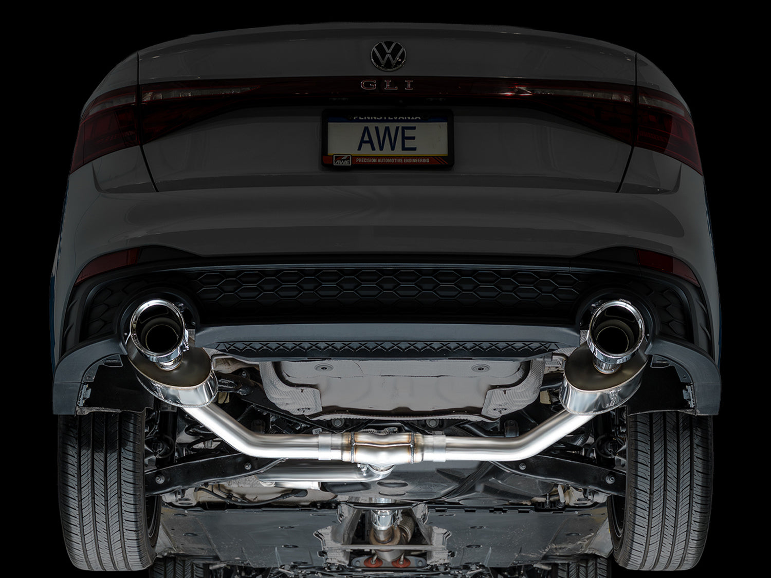 Rear underside of a 2022+ Jetta GLI with the AWE Touring Edition installed, studio lighting