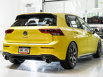 Rear three-quarter view of a yellow Mk8 GTI fitted with the AWE Touring Edition