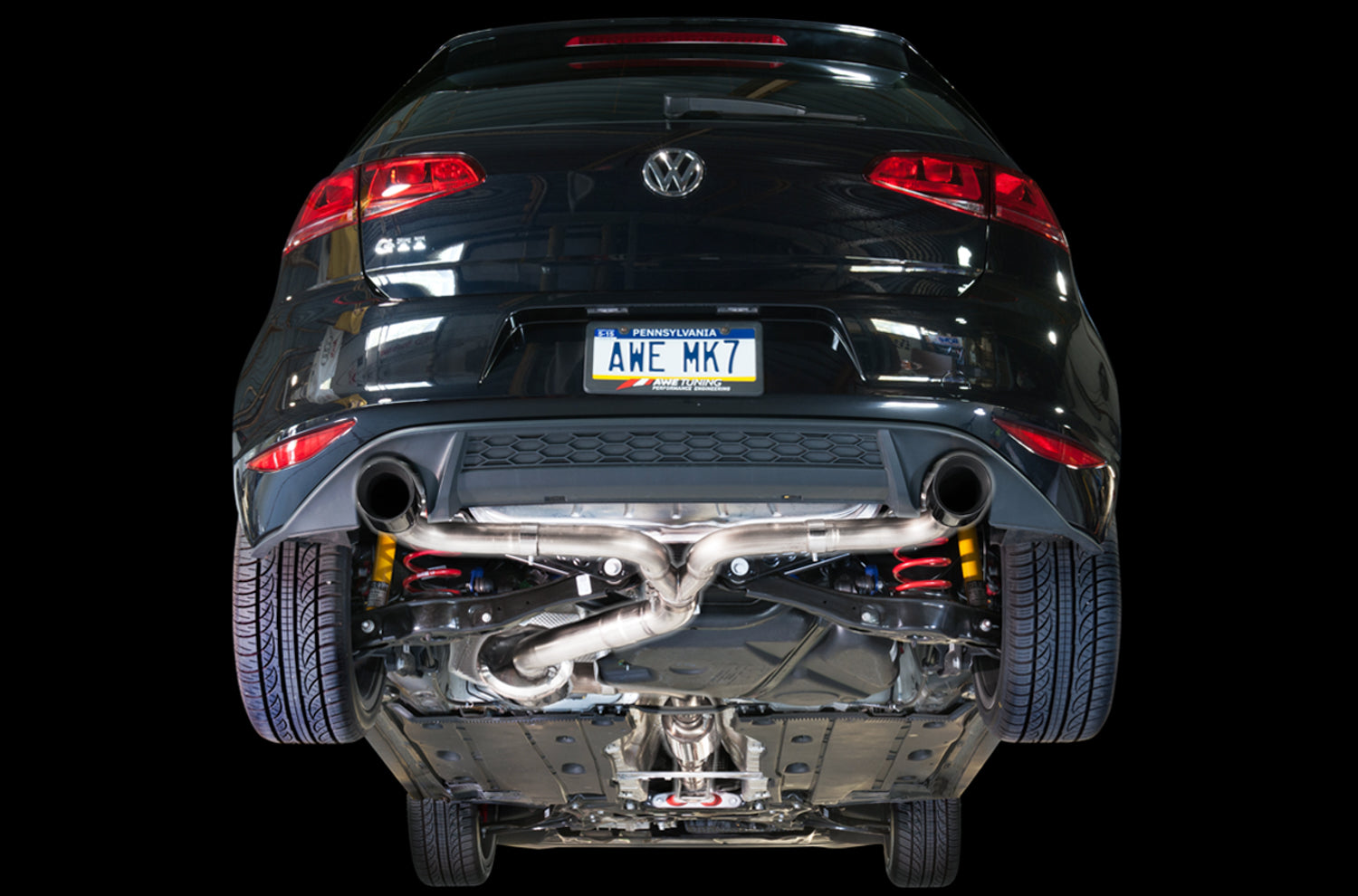 Underside view of the AWE Touring Edition exhaust installed on a Mk7 GTI, rear section and mufflers