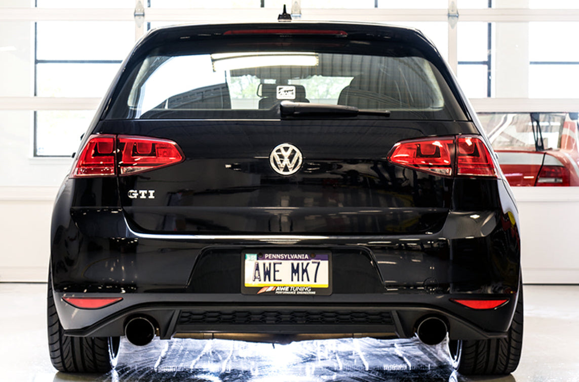 Rear of a black Mk7 GTI in the studio showing dual AWE 102mm Diamond Black tips