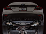 Rear of a white VB WRX on a lift showing the AWE Touring axle-back and quad tips