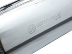 Close-up of the 180 Technology logo stamped on the AWE GR Corolla Touring muffler