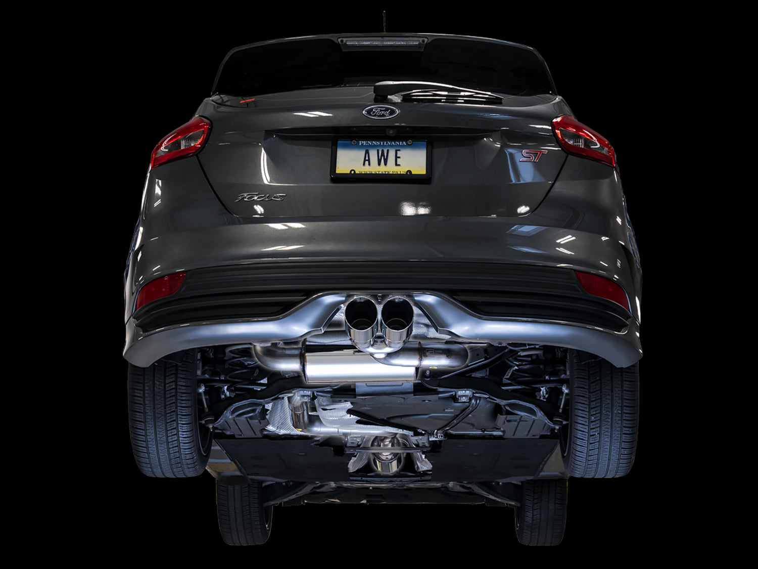 Gray Focus ST on a black background with the AWE Touring cat-back visible under the bumper