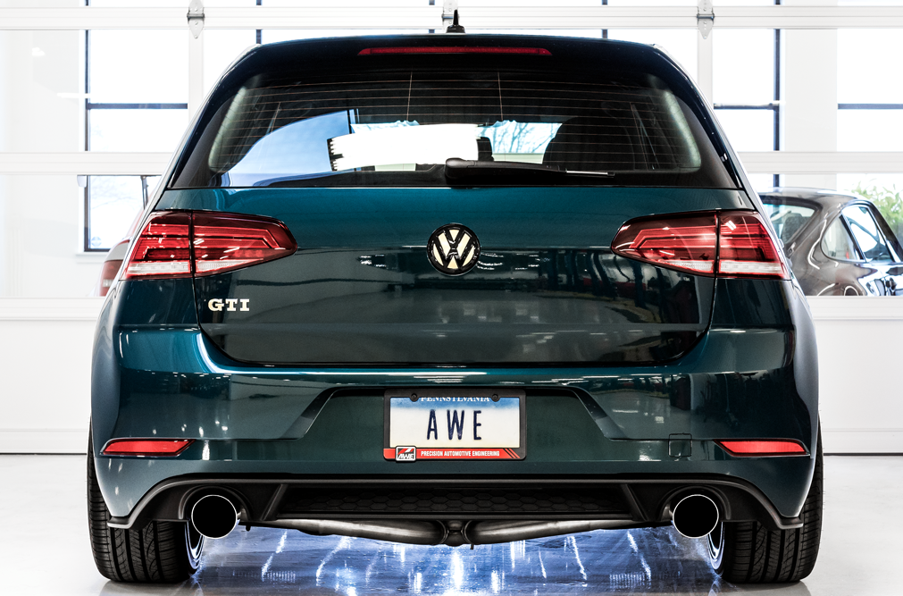 Rear of a green GTI Mk7.5 in the studio with dual AWE exhaust tips under the bumper