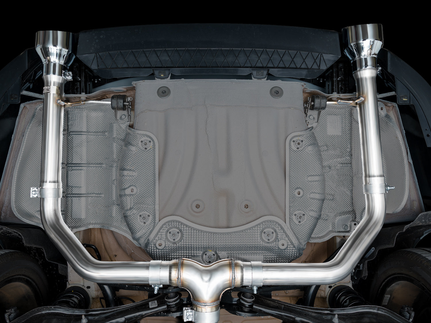 Underside view of the AWE Track Edition T-merge and straight rear sections on the GLI